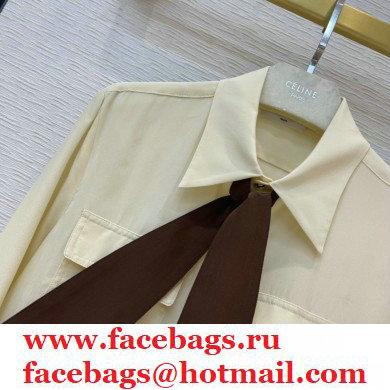 celine off white silk shirt with black tie 2021