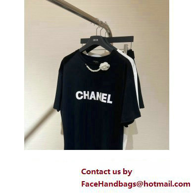 chanel black T-SHIRT with a camellia necklace 2023